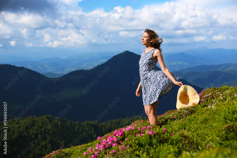 The girl enjoys landscapes in the mountains of the Carpathians. The girl enjoys landscapes in the mountains of the Carpathians.