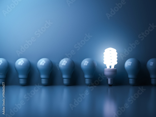 Eco energy saving light bulb , One glowing compact fluorescent lightbulb standing out from unlit incandescent bulbs reflection on blue background , individuality and different concept . 3D rendering.