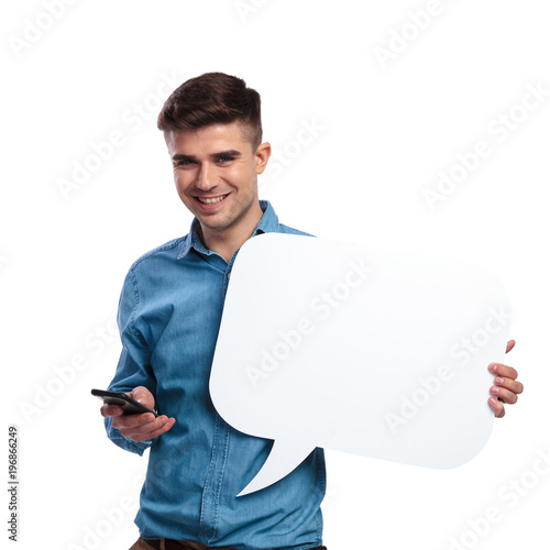 man texting on the phone and holds a speech bubble