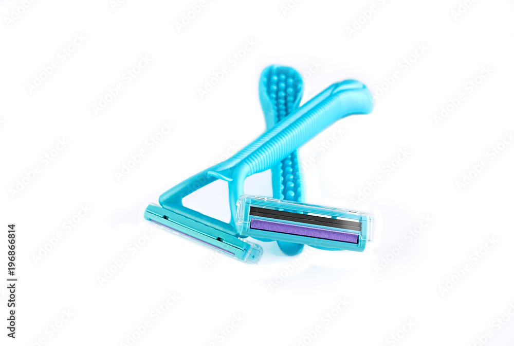 Blue female razors isolated on the white background. Razor for female shaving. Blue female razors isolated on the white background. Razor for female shaving.