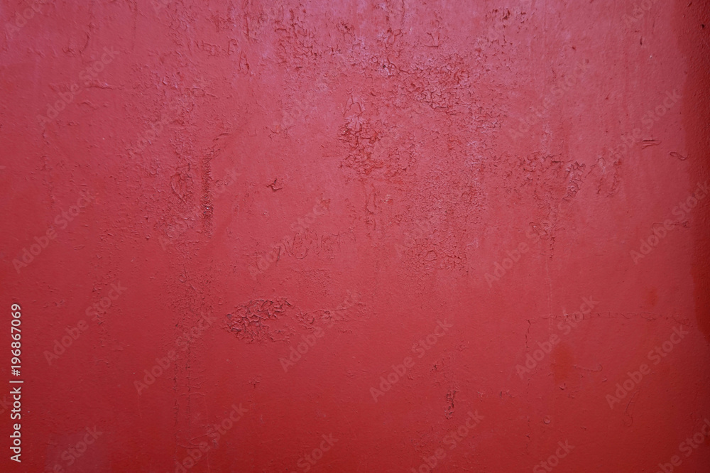 texture of an old red wall with small cracks 