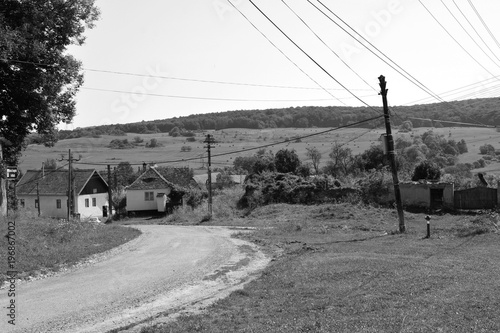 Typical rural landscape and peasant houses in  the village Somartin, Martinsberg, Märtelsberg, Transylvania, Romania. The settlement was founded by the Saxon colonists  photo