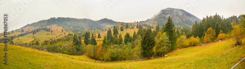 Panoramic view over the landscape around the village Prisaca Dornei in Suceava County, Bucovina, Romania photo