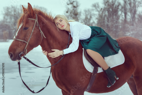 Beautiful woman on horseback.
