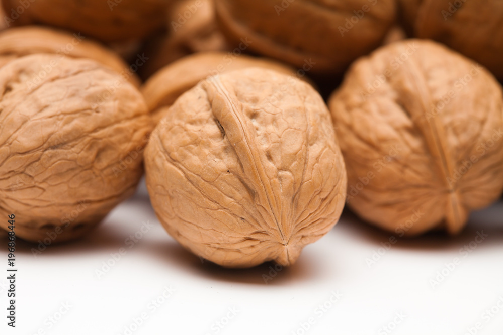 A group of whole walnut on white background A group of whole walnut on white background
