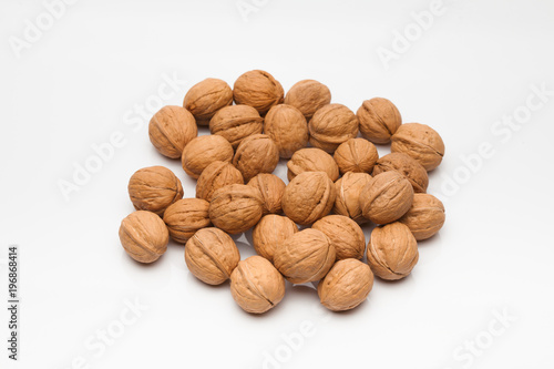 A group of whole walnut on white background