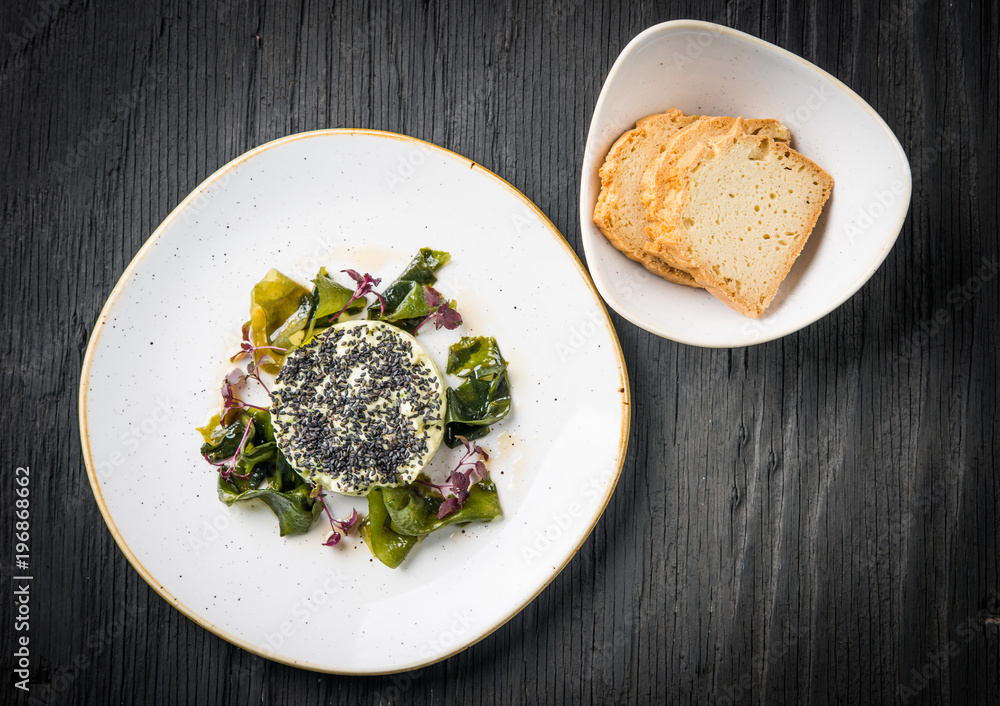 Vegan tartar with wakame seaweed and black sesame, top view Vegan tartar with wakame seaweed and black sesame, top view
