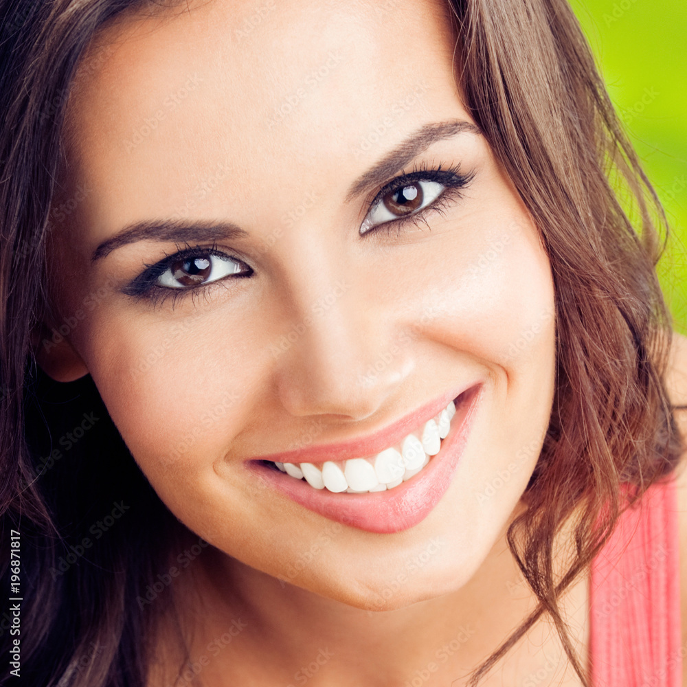 Happy smiling young woman, outdoors Happy smiling young woman, outdoors