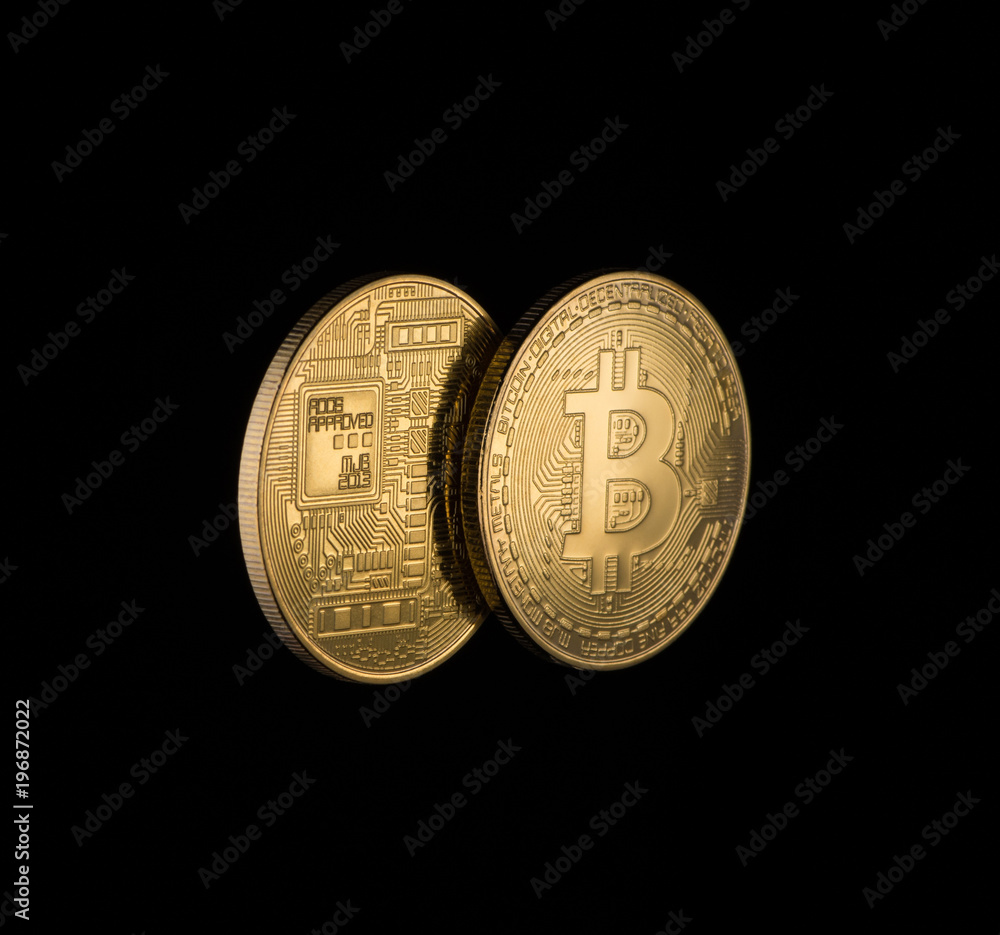 two Golden bitcoins on black background with copy space. electronic money isolated two Golden bitcoins on black background with copy space. electronic money isolated