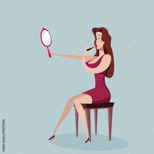 Woman applying lipstick looking at mirror in hand