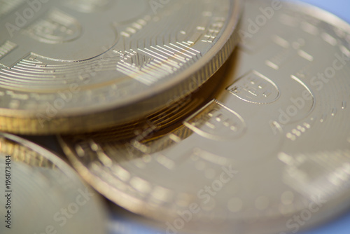 several gold bitcoin closeup, blurred photo. electronic money