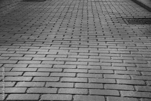 Gray Brick Stone Paved road in historic square