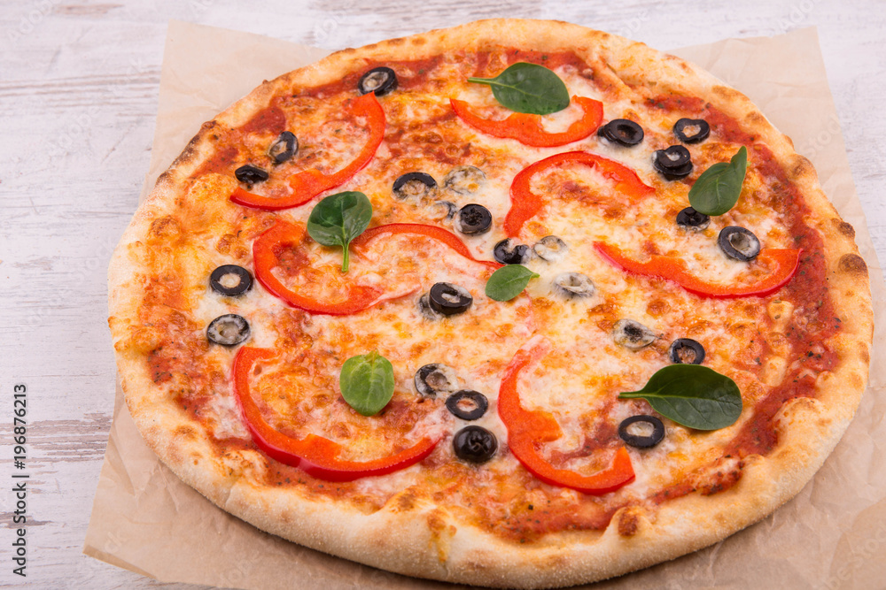 The black cut olives and red pepper pizza