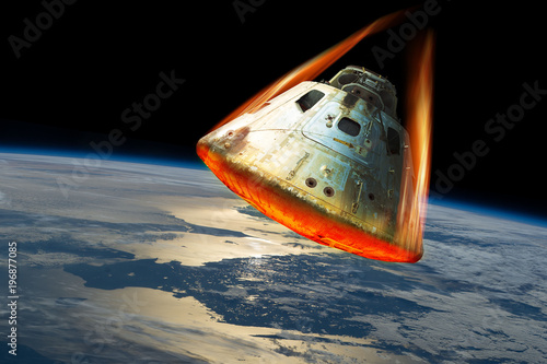 Reentry of space capsule into Earth's Atmosphere. - Elements of this image courtesy of NASA. photo