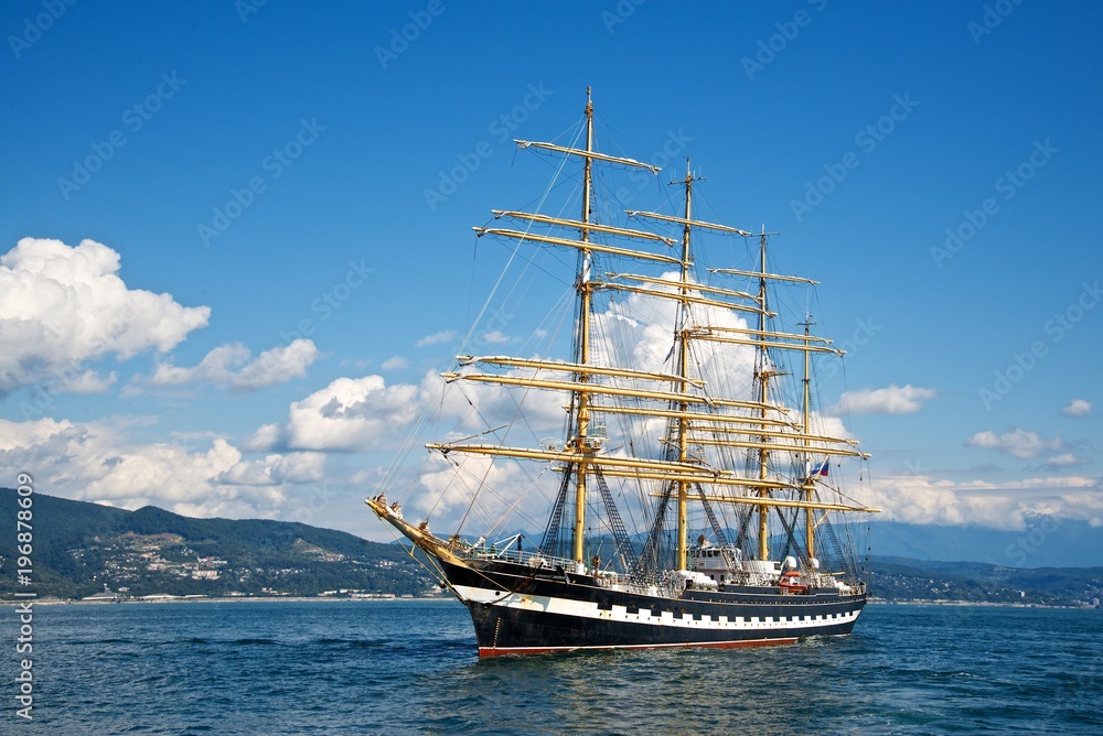 Tall ship race in the Black sea. Large white sails on masts. Beauty seascape. Tall ship race in the Black sea. Large white sails on masts. Beauty seascape.