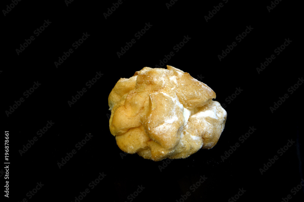 profiteroles on a black background profiteroles on a black background