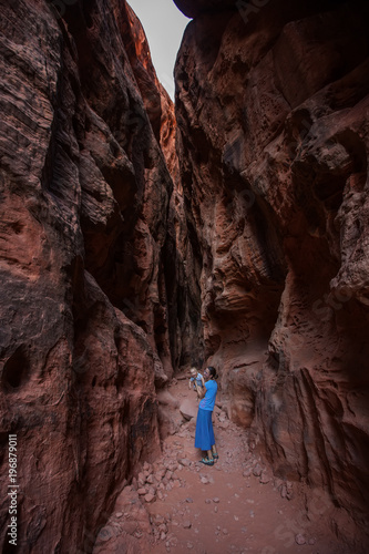 Mother and son on a trail in volcanic Snow canyon State Park in Utah, USA