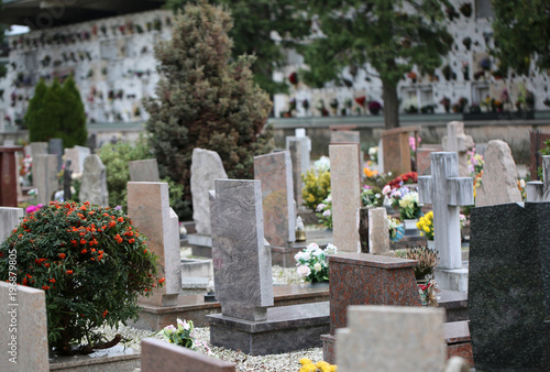 inside a cemetery with many tombs and tombstones