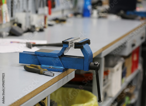 Cuadro en lienzo iron vise inside a mechanical workshop