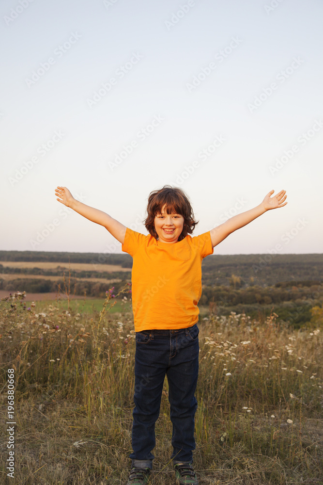 Portrait of happy cheerful smiling boy on the meadow in spring day Portrait of happy cheerful smiling boy on the meadow in spring day