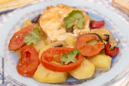 fish with potatoes and tomato