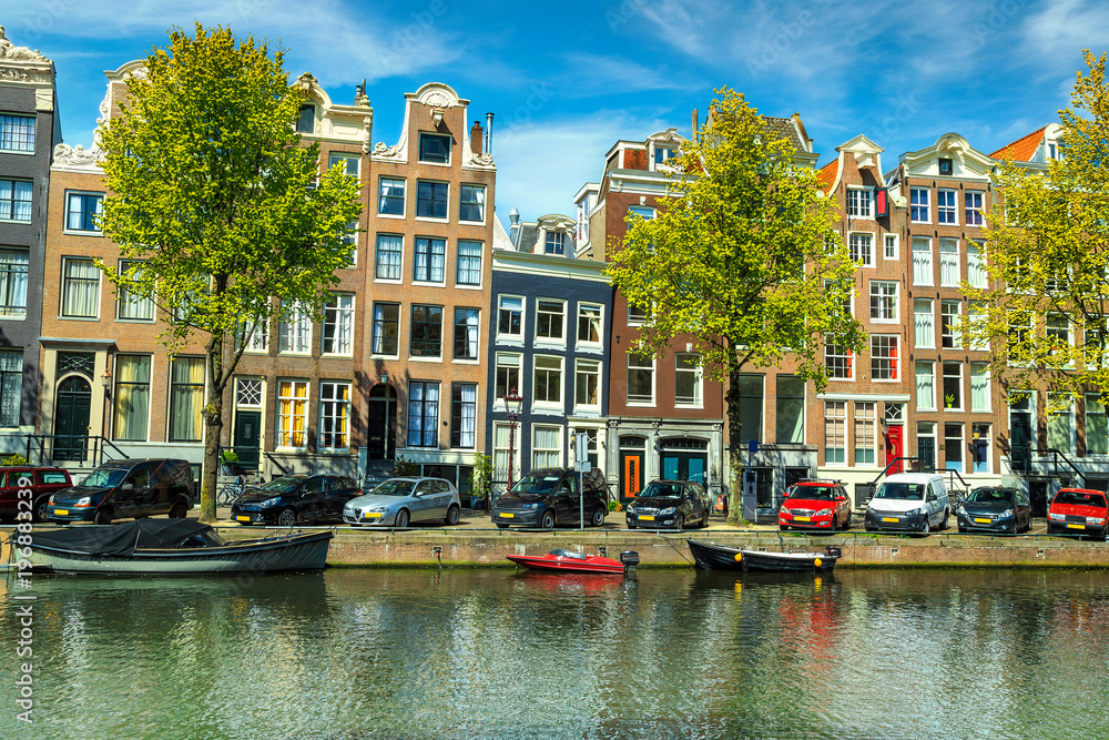 Fantastic traditional buildings and water canal in Amsterdam, Netherlands, Europe