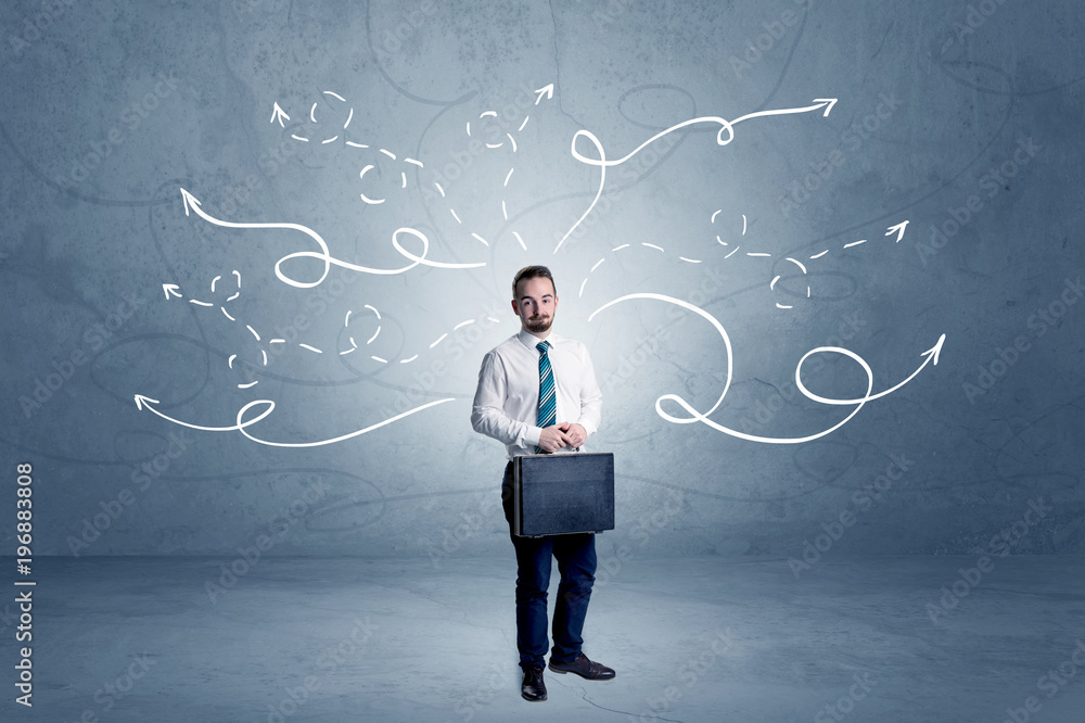 Businessman standing with winding arrows around Businessman standing with winding arrows around