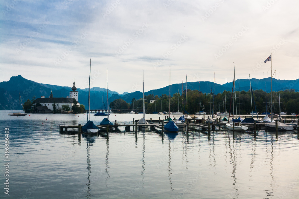 Marina with sailing boats and Church on the lake Traunsee in the Austrian Alps, Austria