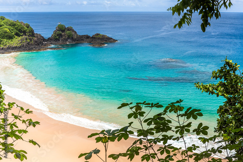Fernando de Noronha, Brazil. Aerial view of Sancho Beach on Fernando de Noronha Island. View without anyone on the beach. Trees and plants around. photo