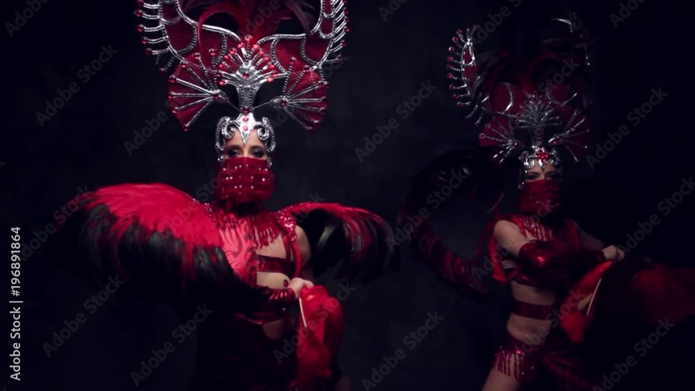 Beautiful women in crowns and carnival dresses Beautiful women in crowns and carnival dresses