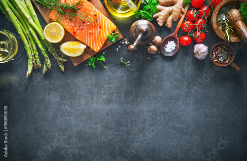 Fresh salmon fillet with aromatic herbs, spices and vegetables