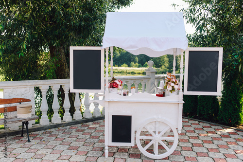 trolley with ice cream stands in the park in spring