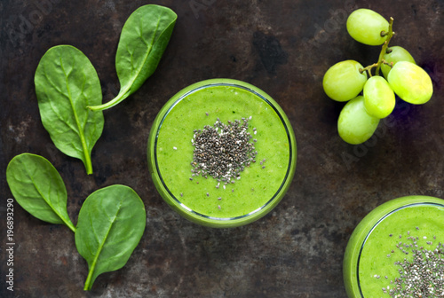 Green avocado, spinach and grape smoothie with chia seeds - healthy breakfast idea.