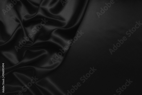 black abstract background luxury cloth or liquid wave or wavy folds of grunge silk texture satin velvet material or luxurious Christmas background or elegant wallpaper design, background