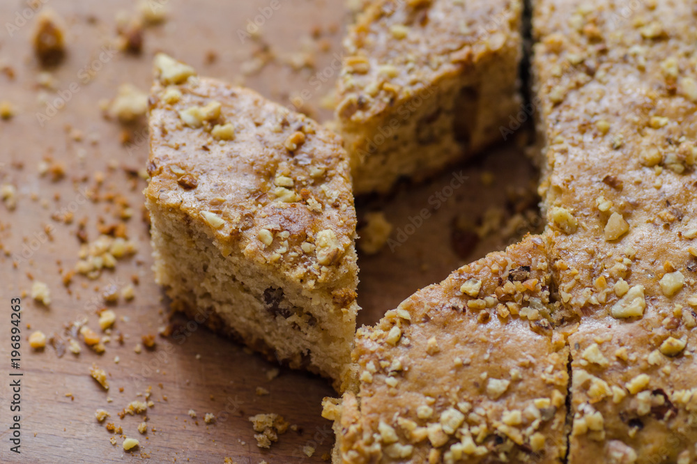 Nuts and honey cake on wooden surface, selective focus Nuts and honey cake on wooden surface, selective focus