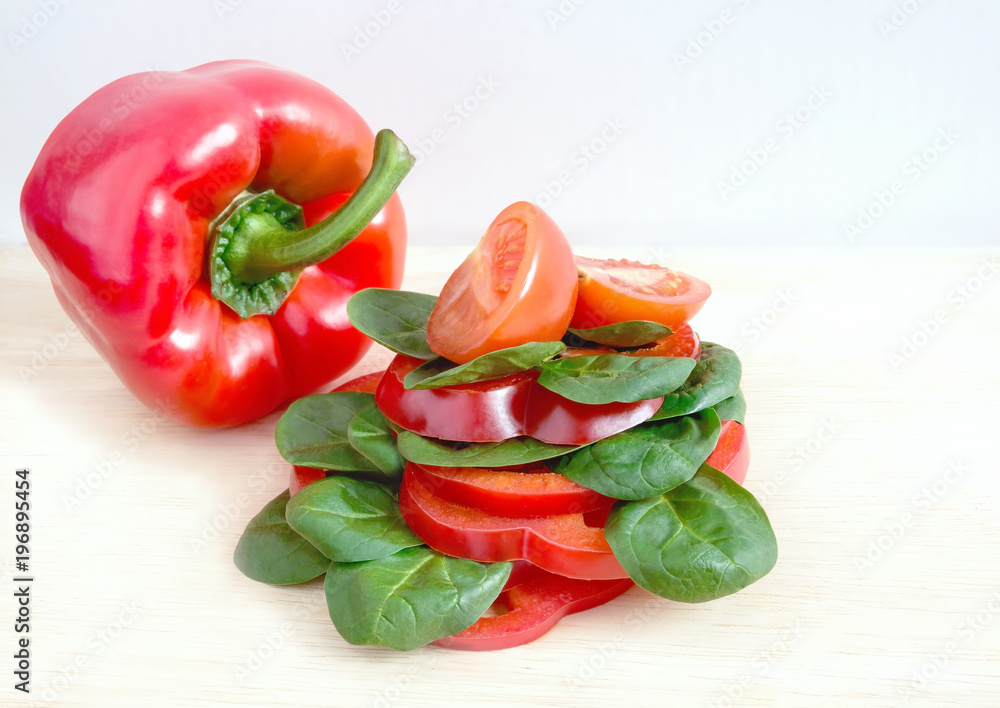 sandwich with vegetables, pepper, tomato, lettuce on a light background sandwich with vegetables, pepper, tomato, lettuce on a light background