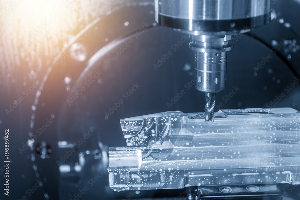 The 5-axis CNC machine cutting the aluminum aerospace part . The 5-axis CNC machine cutting the aluminum aerospace part .