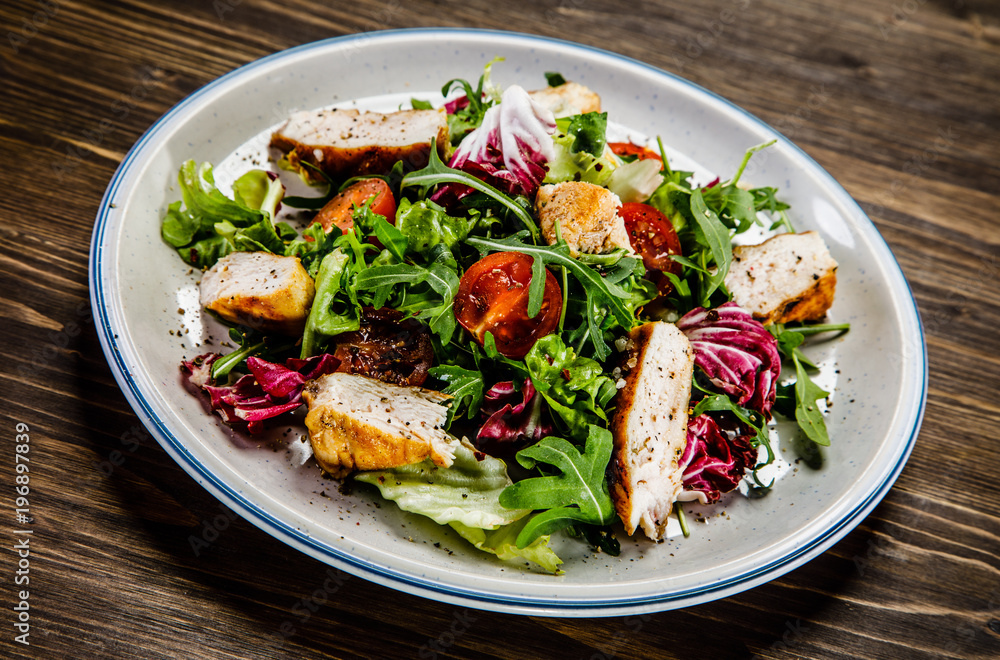 Caesar salad on wooden table 