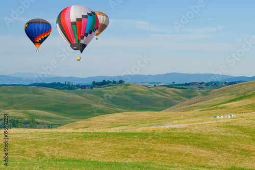 Colorful hot air balloons flying over the mountain