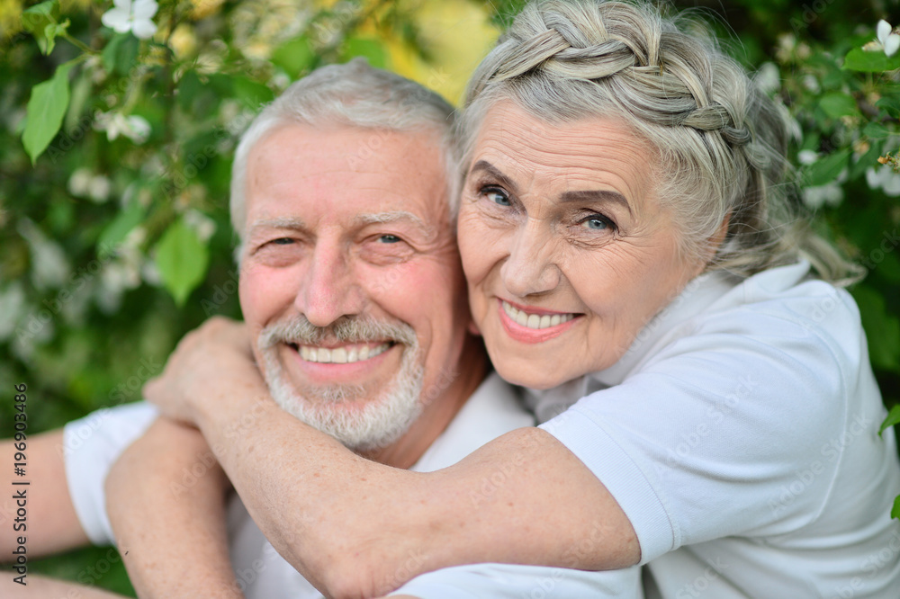 Happy couple hugging in spring park 