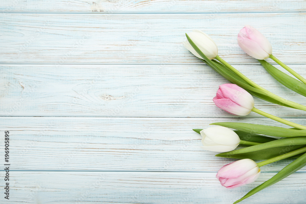 Bouquet of tulips on wooden table Bouquet of tulips on wooden table