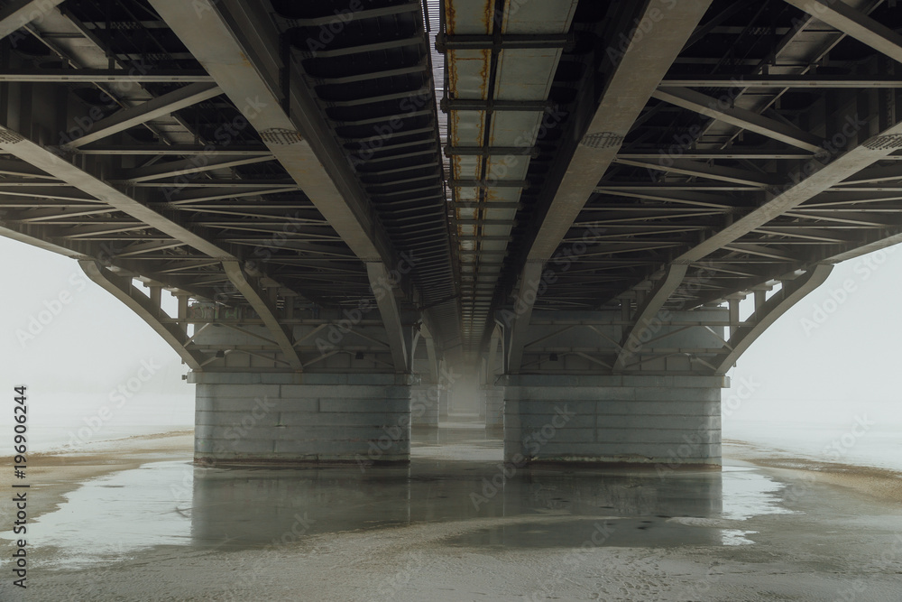 Under Chernavsky Bridge through Voronezh river at foggy winter day Under Chernavsky Bridge through Voronezh river at foggy winter day