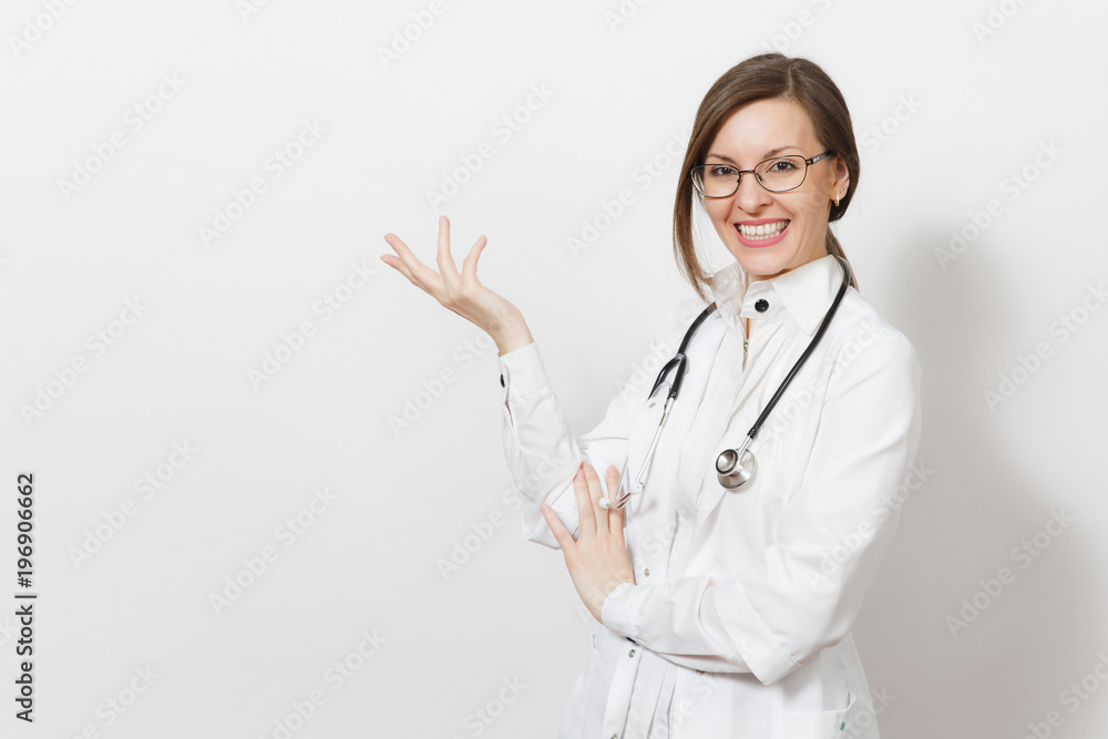 Smiling young doctor woman with stethoscope, glasses isolated on white background. Female doctor in medical gown pointing hand aside on copy space. Healthcare personnel, health, medicine concept. Smiling young doctor woman with stethoscope, glasses isolated on white background. Female doctor in medical gown pointing hand aside on copy space. Healthcare personnel, health, medicine concept.