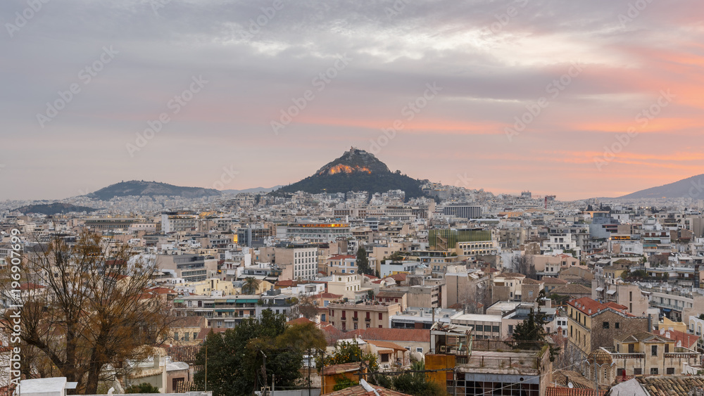View of Lycabettus hill from Anafiotika neighborhood in the old town of Athens, Greece. 
