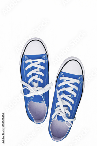 pair of sneakers-colored youth running shoes on a white background, isolated