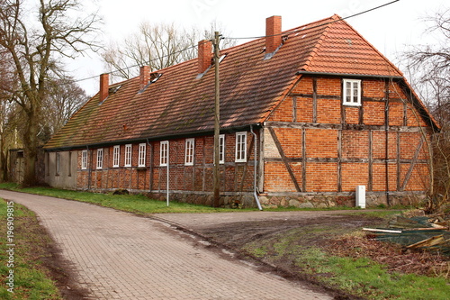 Row of rural workers houses, listed as monument in Schmoldow, Mecklenburg-Western Pomerania, Germany