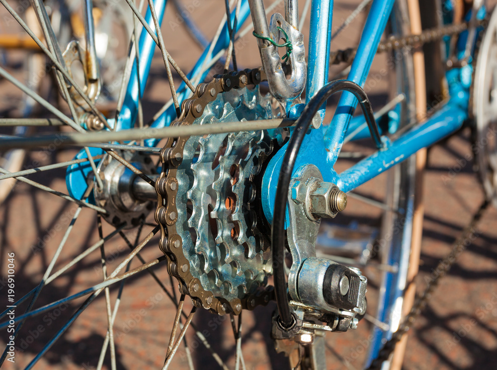 Obraz premium Close-up of the Cassette of Sprockets of a blue Racing Bike, View from the Side
