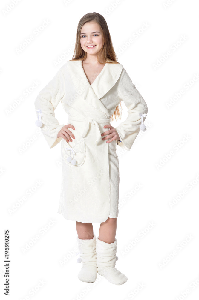 Happy little girl in white bathrobe posing isolated Happy little girl in white bathrobe posing isolated