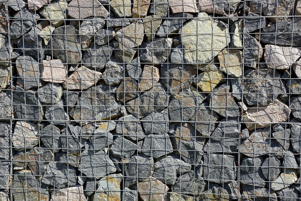 Fototapeta premium texture of the iron stack and stones in the wall