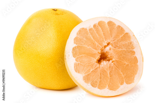 Ripe pomelo and half on a white background